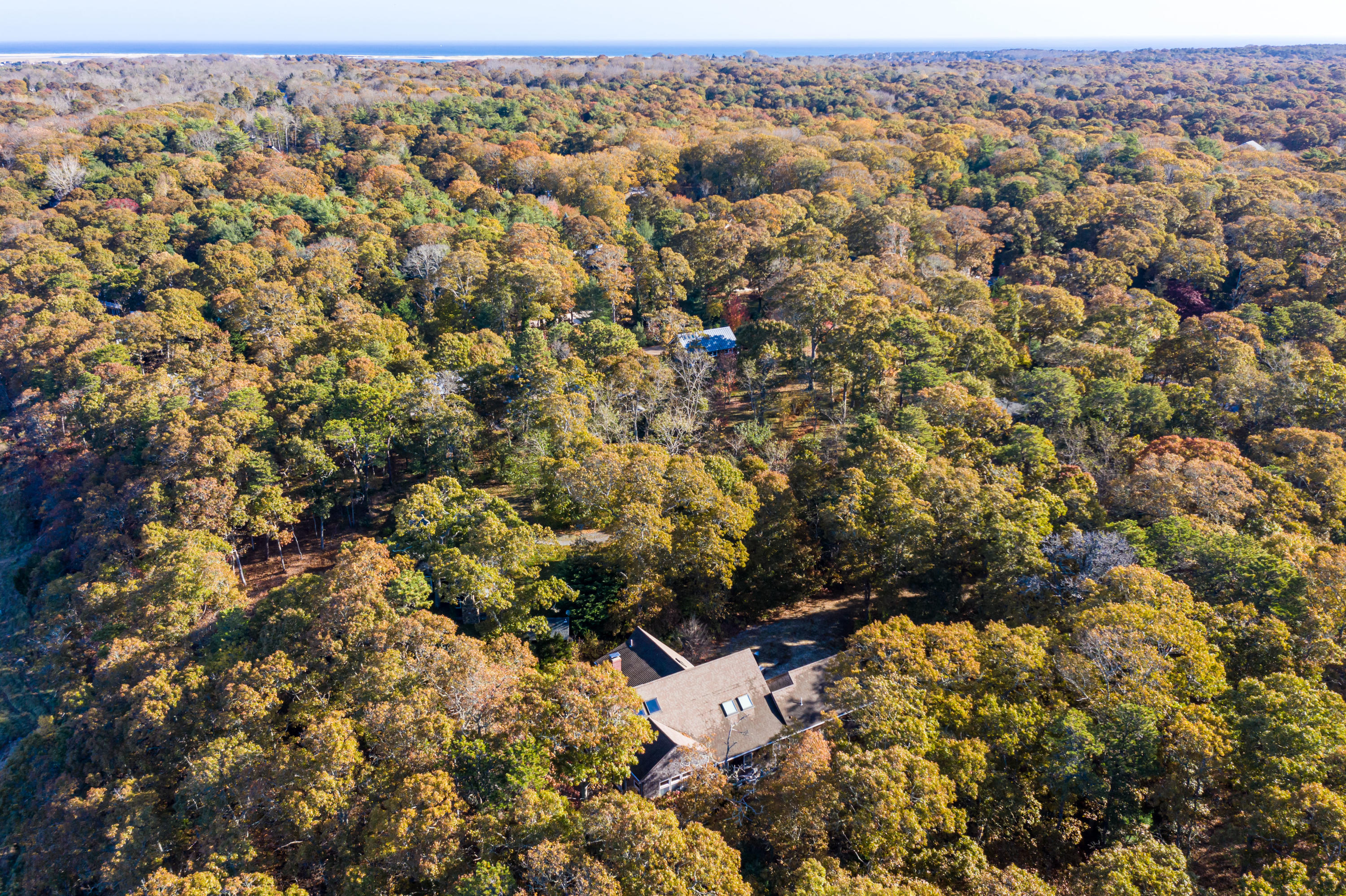 150 Tonset Road Orleans, MA 02653 - Photo 51 of 54 an aerial view of a house with a yard