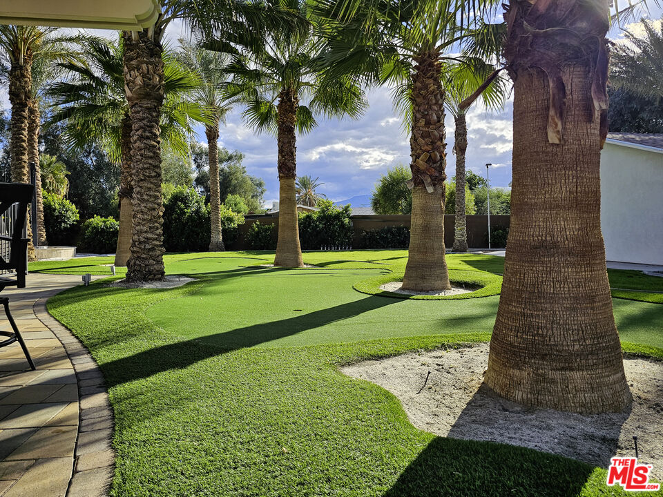 38580 Rancho Los Cerritos Drive, Unit S1 Indio, CA 92203 - Photo 11 of 39 a view of a yard with palm trees