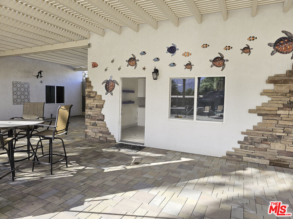 38580 Rancho Los Cerritos Drive, Unit S1 Indio, CA 92203 - Photo 17 of 39 a view of a livingroom with furniture and window