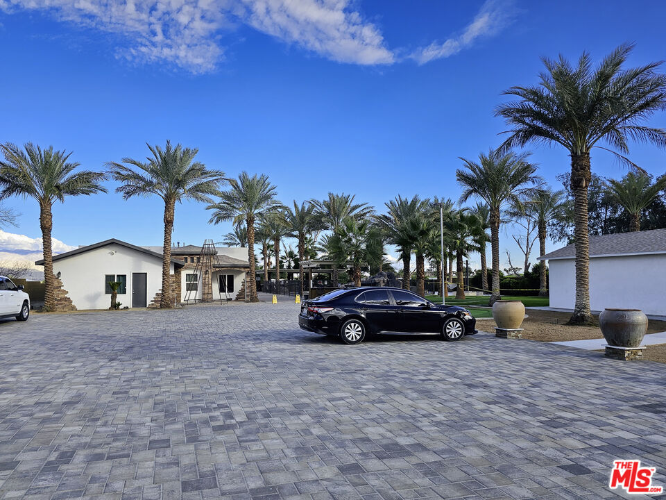38580 Rancho Los Cerritos Drive, Unit S1 Indio, CA 92203 - Photo 19 of 39 a view of a car parked in front of a house