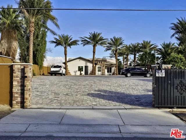 a view of street with palm trees