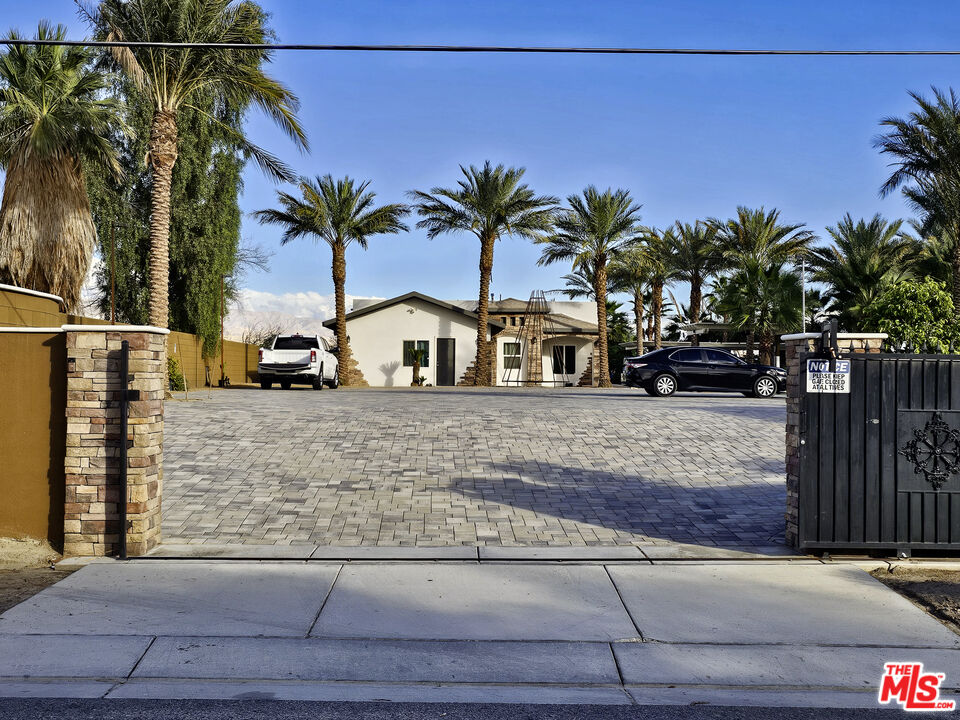 38580 Rancho Los Cerritos Drive, Unit S1 Indio, CA 92203 - Photo 20 of 39 a view of street with palm trees