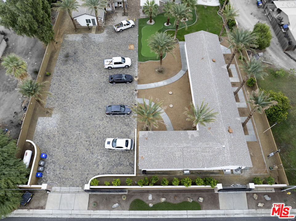 38580 Rancho Los Cerritos Drive, Unit S1 Indio, CA 92203 - Photo 26 of 39 an aerial view of a house with yard swimming pool and outdoor seating