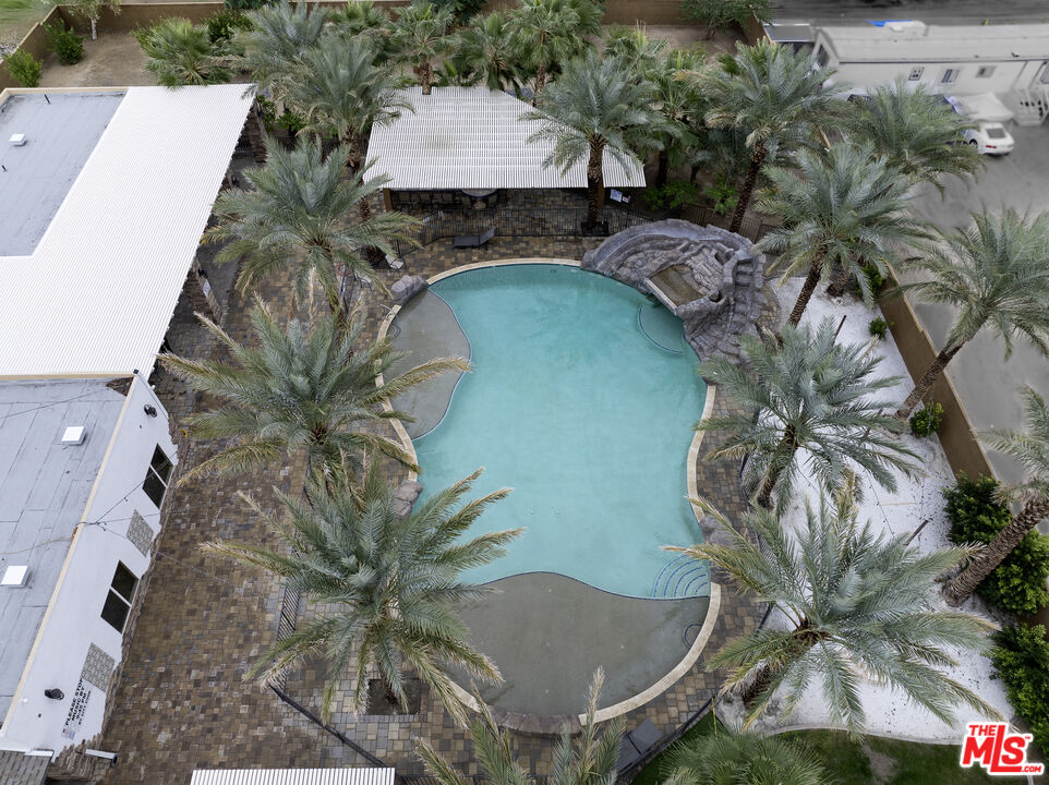 38580 Rancho Los Cerritos Drive, Unit S1 Indio, CA 92203 - Photo 28 of 39 a picture of a table and chairs in patio