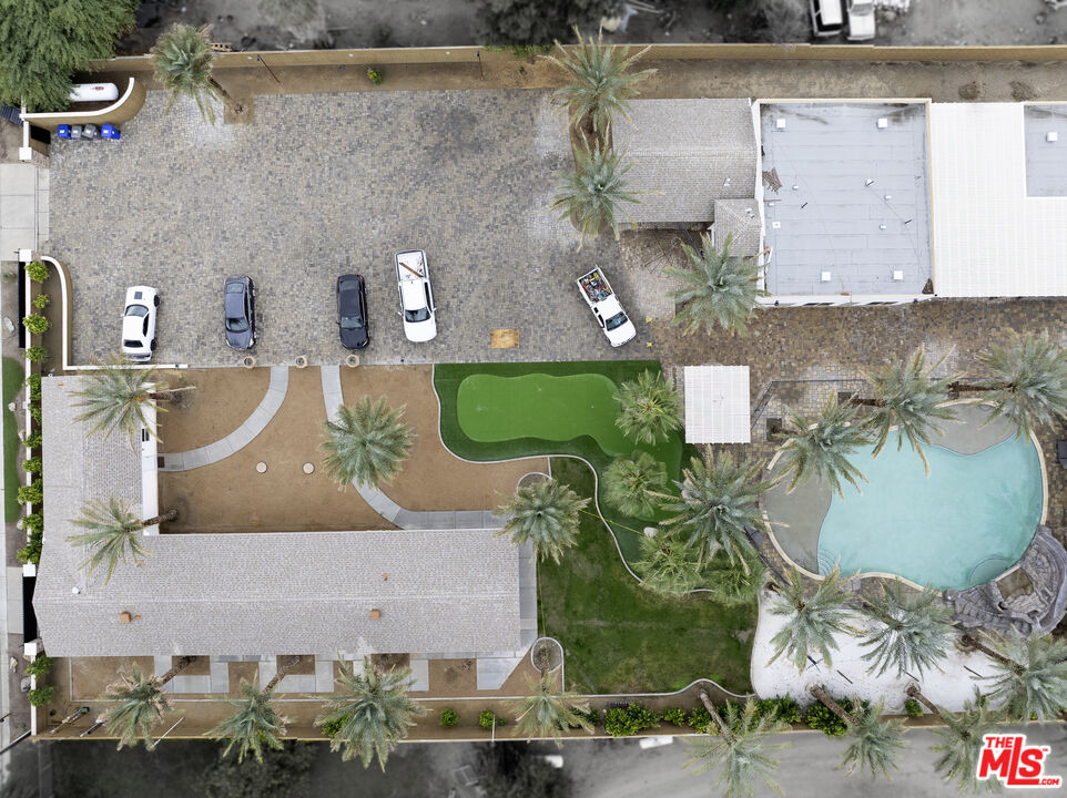 38580 Rancho Los Cerritos Drive, Unit S1 Indio, CA 92203 - Photo 33 of 39 an aerial view of a house with a yard