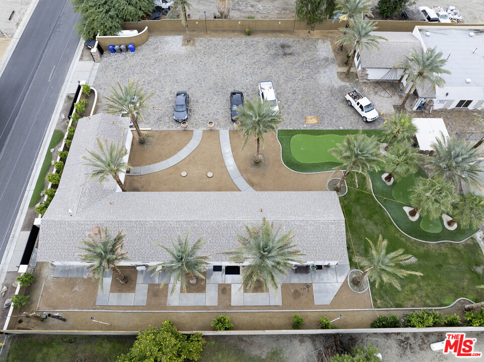 38580 Rancho Los Cerritos Drive, Unit S1 Indio, CA 92203 - Photo 34 of 39 an aerial view of a house with garden space and swimming pool