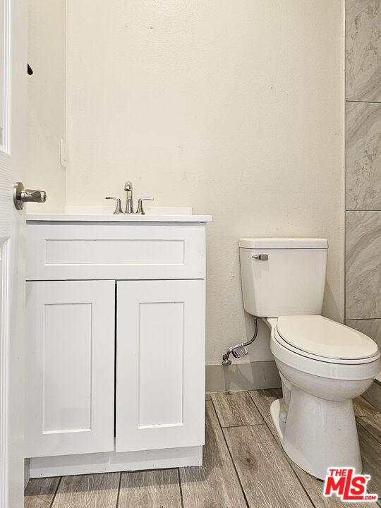 38580 Rancho Los Cerritos Drive, Unit S1 Indio, CA 92203 - Photo 5 of 39 a bathroom with a toilet and a sink