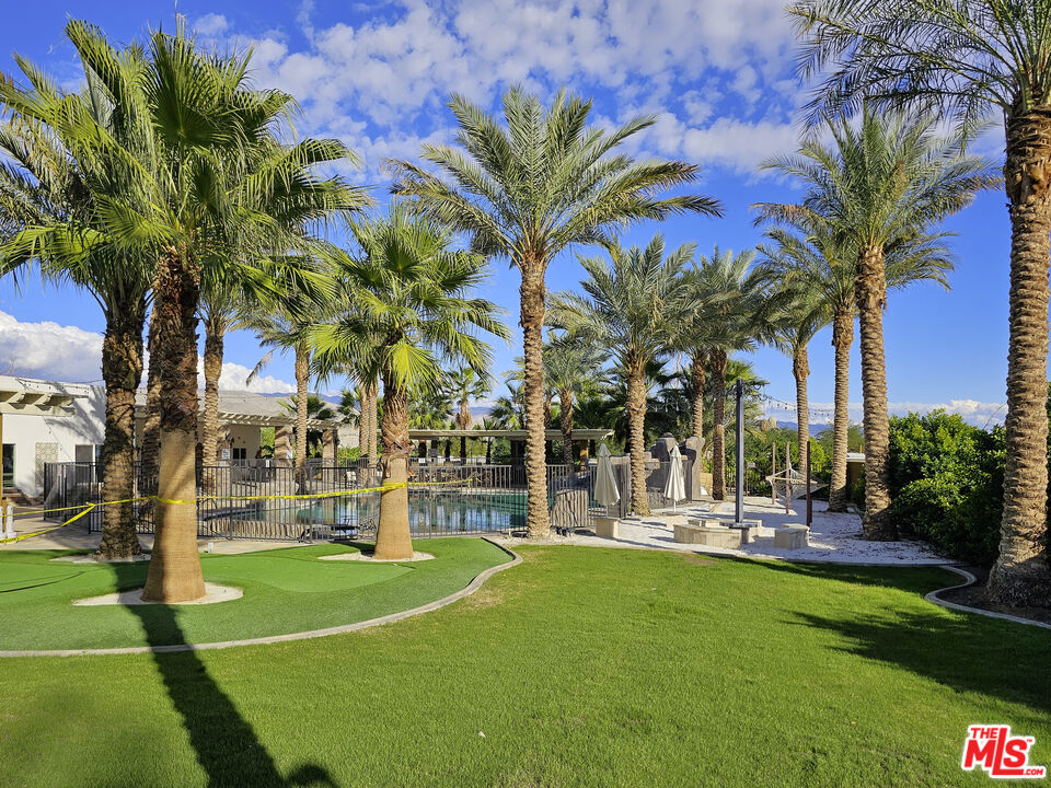 38580 Rancho Los Cerritos Drive, Unit S1 Indio, CA 92203 - Photo 9 of 39 a view of a playground with basketball court
