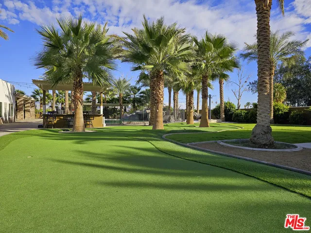 a view of a palm trees in front of a house