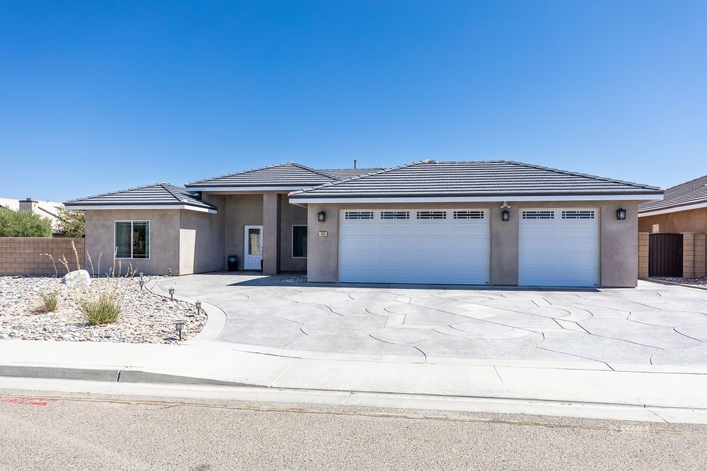 1030 Arroyo Street Ridgecrest, CA 93555 - Photo 2 of 49 a front view of a house with windows