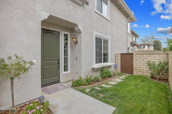 a house with garden in front of it