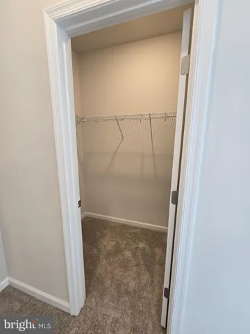 a view of a livingroom with wooden floor and window