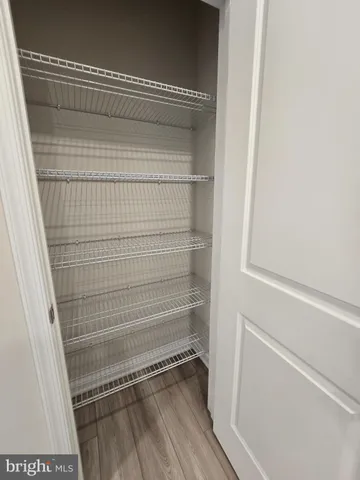 a view of hallway with bathroom