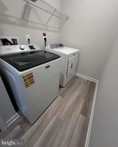 a bathroom with a granite countertop sink mirror and a bath tub