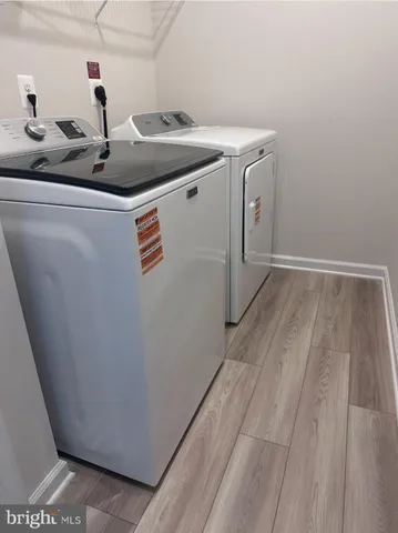a bathroom with a double vanity sink and mirror