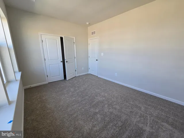 a bathroom with a white bath tub a toilet and a shower
