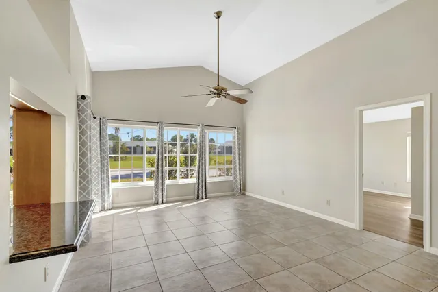 a view of a livingroom with a ceiling fan and a window