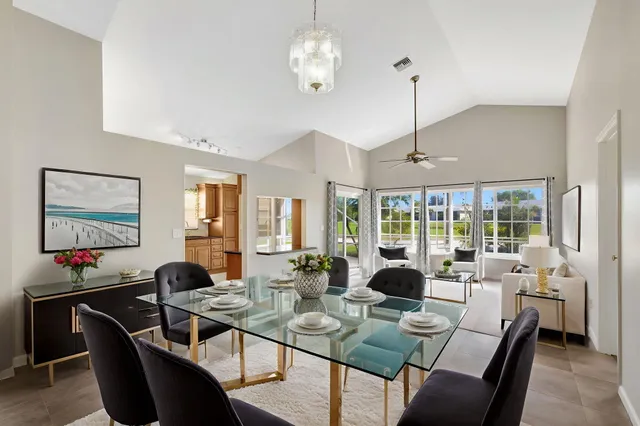 a view of a dining room with furniture window and outside view