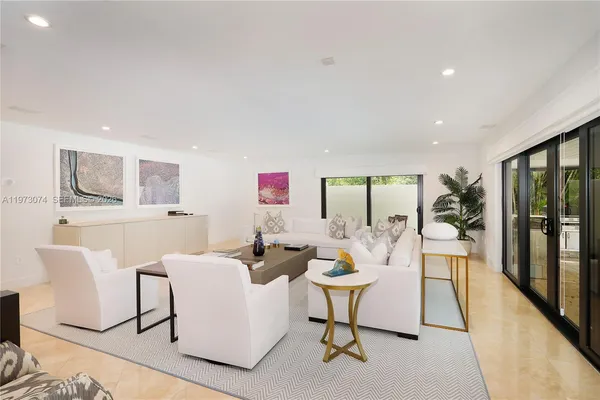 a living room with furniture and a table