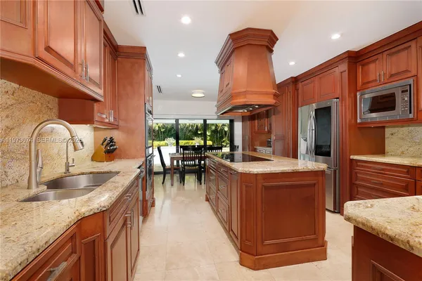 a kitchen with a stove and a sink