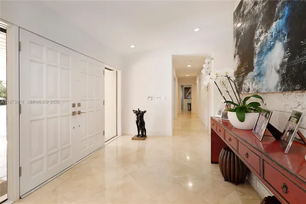 a spacious bathroom with a double vanity sink and mirror