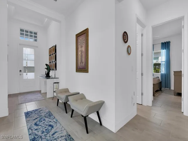 a living room with furniture and a rug
