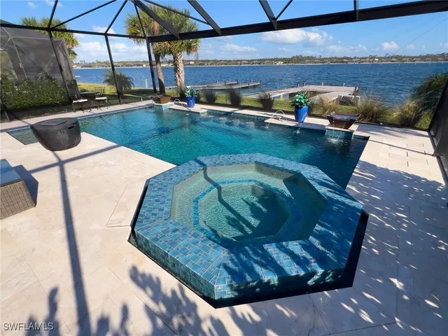 a view of a swimming pool with a patio