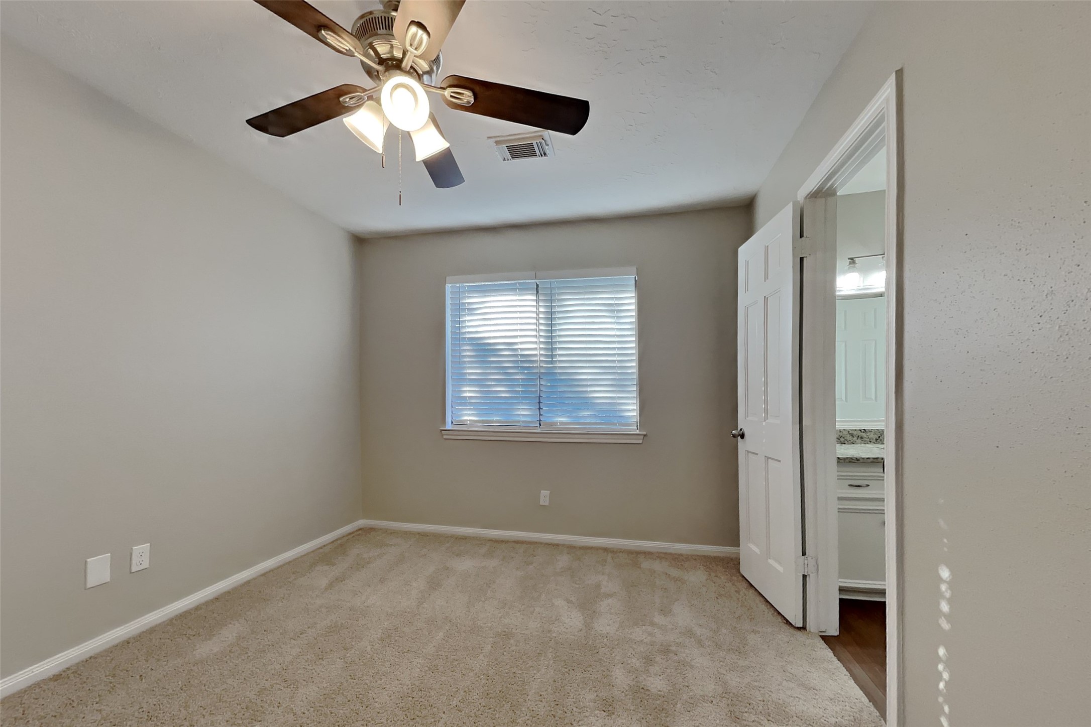 3423 Berry Grove Drive Spring, TX 77388 - Photo 14 of 21 an empty room with windows and fan