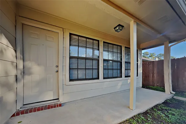 a view of entrance gate of a house