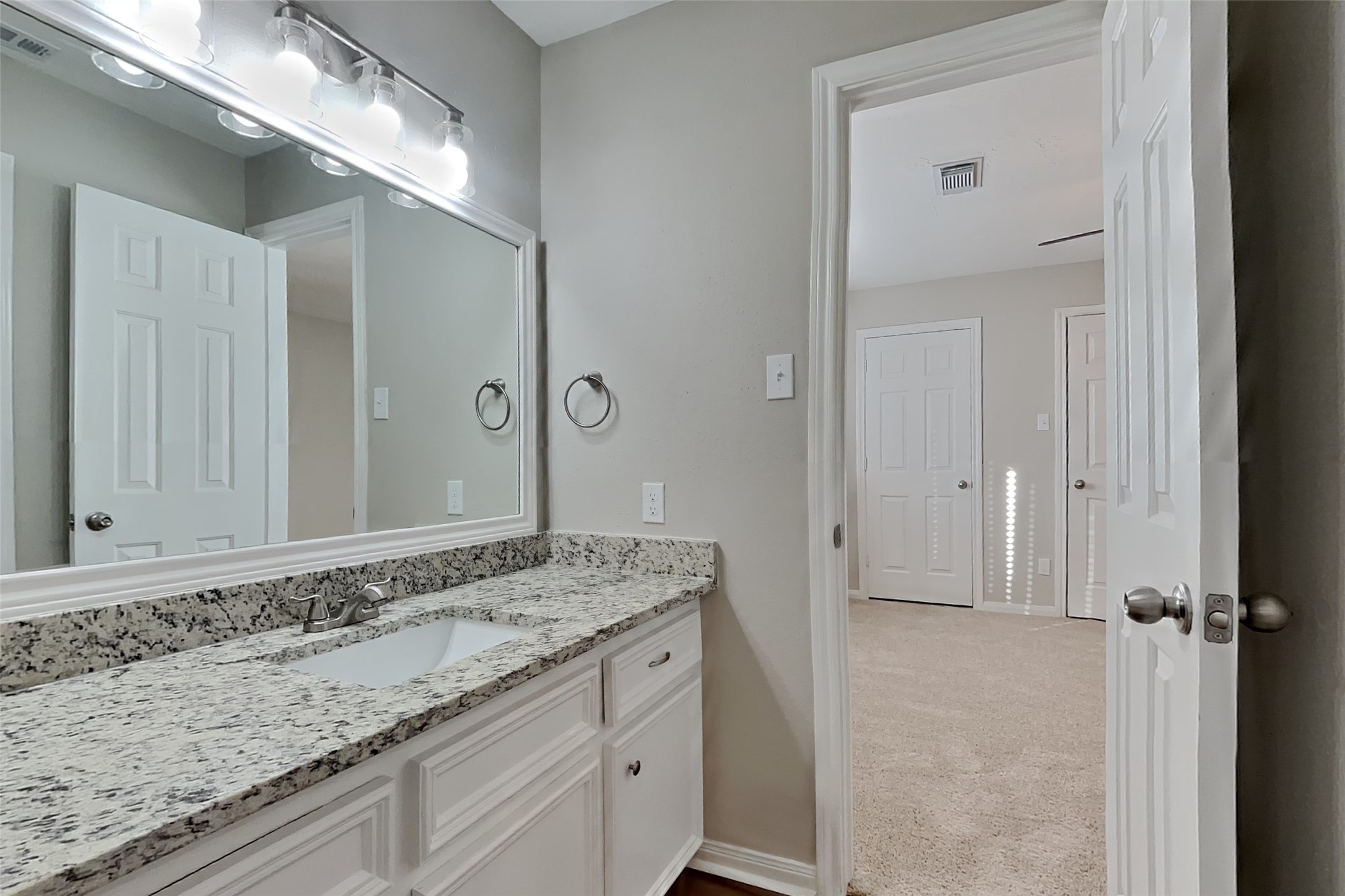 3423 Berry Grove Drive Spring, TX 77388 - Photo 19 of 21 a bathroom with a granite countertop sink and a mirror