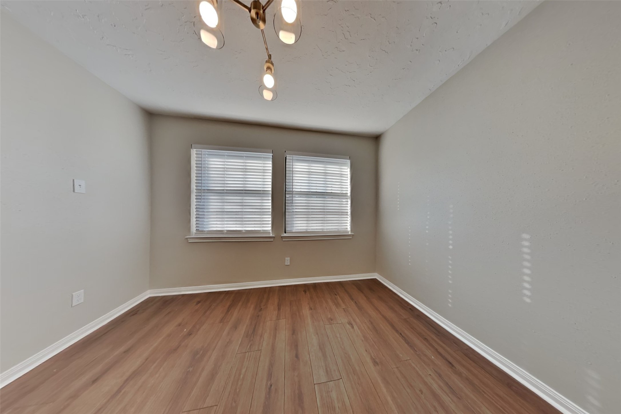 3423 Berry Grove Drive Spring, TX 77388 - Photo 10 of 21 wooden floor in an empty room with a window