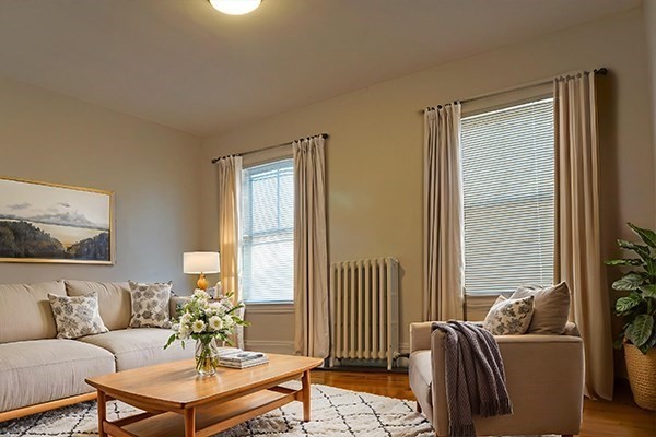 141 Brown Street, Unit 2F Waltham, MA 02453 - Photo 3 of 8 a living room with furniture and a window