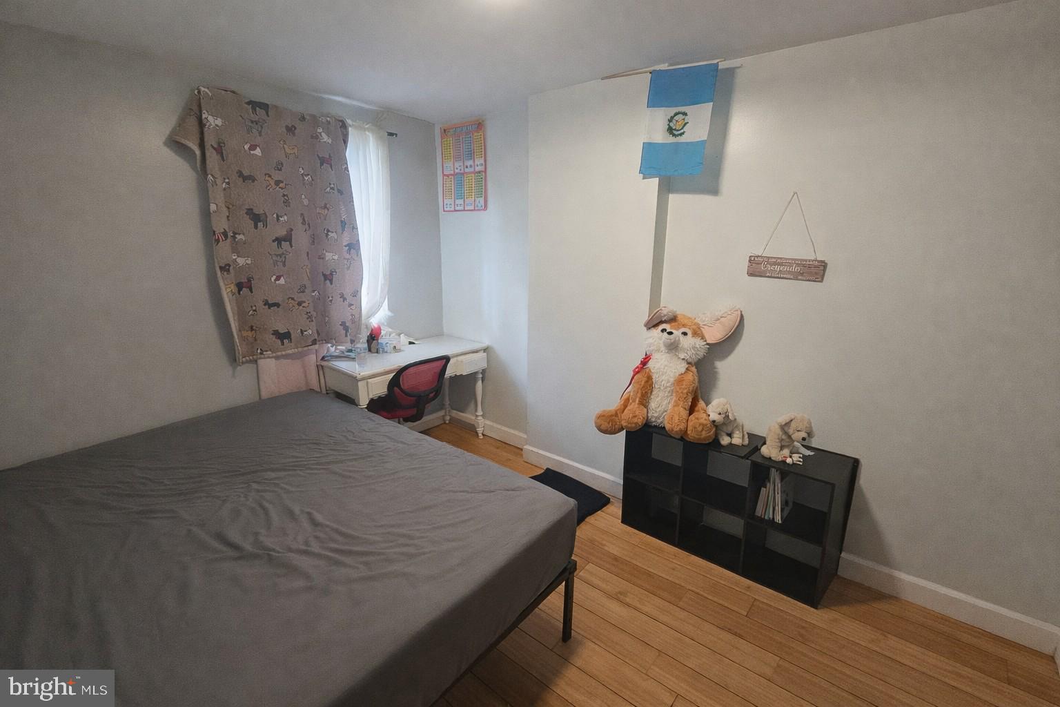 1315 Honan Street Chester, PA 19013 - Photo 5 of 15 a bedroom with a bed and wooden floor