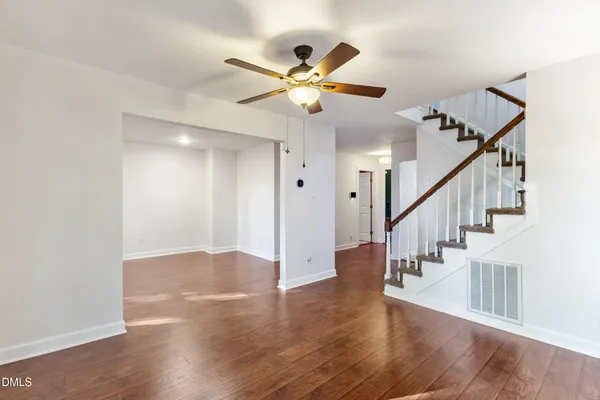 a view of an entryway with wooden floor