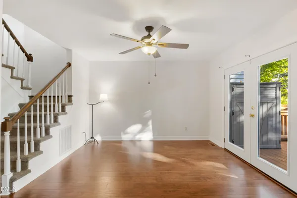 a view of an entryway with wooden floor