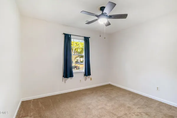 a balcony with wooden floor and fence