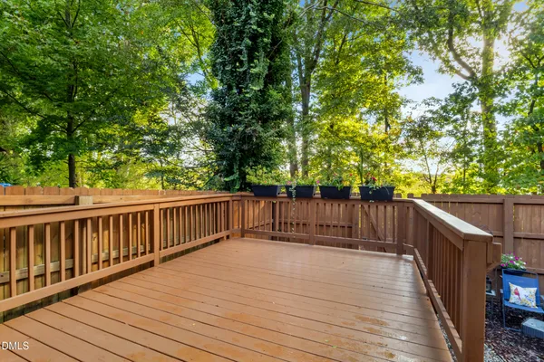 a view of deck with wooden floor and fence