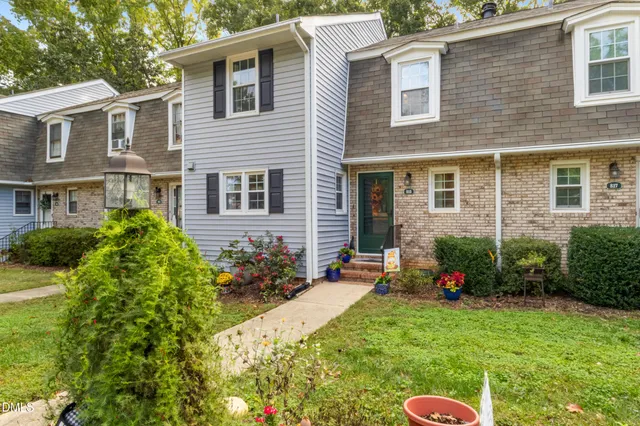 a view of a hallway view with wooden floor and staircase