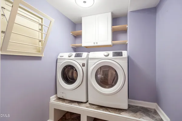 a utility room with dryer and washer