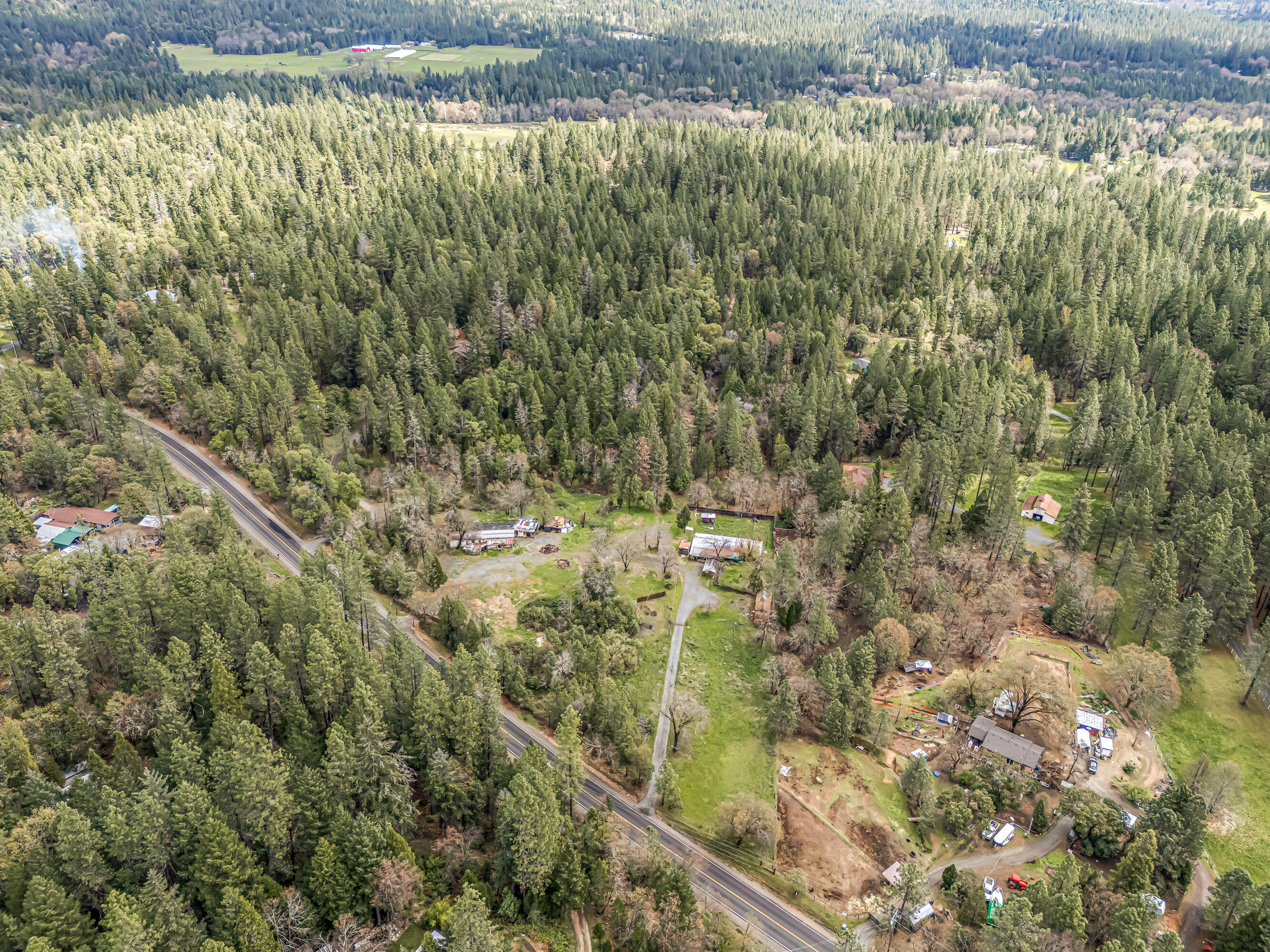 9650 West Evans Creek Road Rogue River, OR 97537 - Photo 10 of 10 a view of a houses with a lush green forest