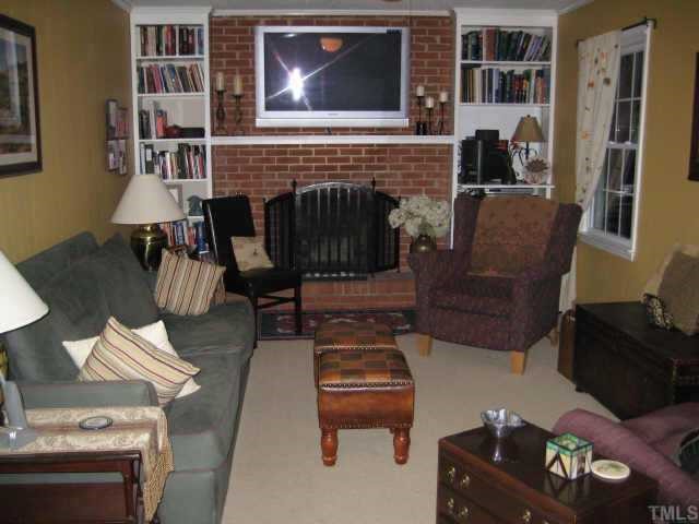 518 Andover Road Durham, NC 27712 - Photo 2 of 9 a living room with furniture and a fireplace