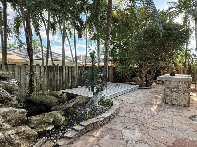 a garden view with a fountain