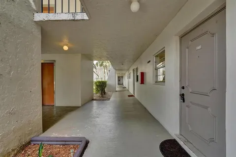 a view of a hallway with workspace
