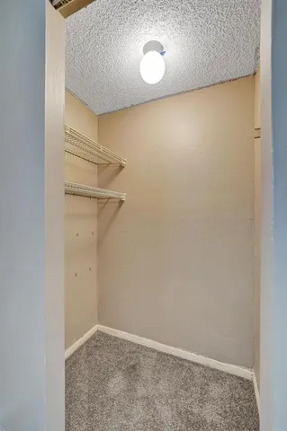 a view of an entryway with wooden floor and staircase