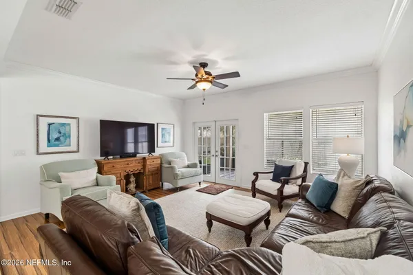 a bedroom with a bed lamp and a dresser