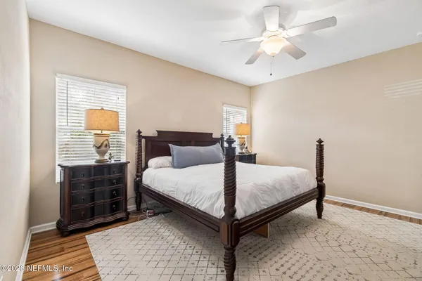 a bathroom with a sink double vanity granite tub and a mirror