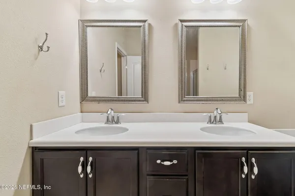 a white bath tub sitting next to a window