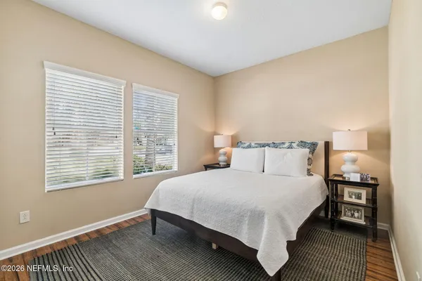 a bed room with a bed and a night stand