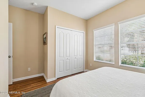 a view of a workspace with furniture and wooden floor