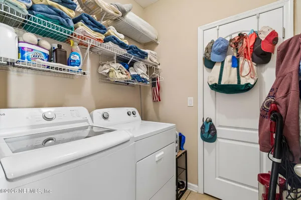 a view of a livingroom with wooden floor and furniture